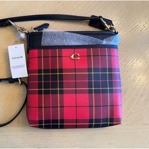 Coach Crossbody purse. New with tags. No damage. Red plaid with brown leather.